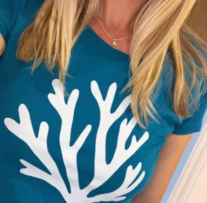 White coral on blue / green tee